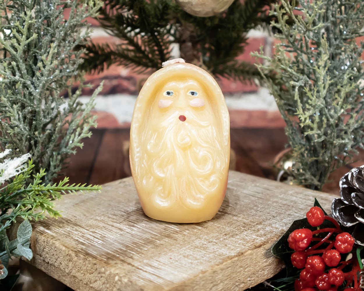 Hand-painted beeswax Santa candle with natural honey color, perfect for Christmas home décor.