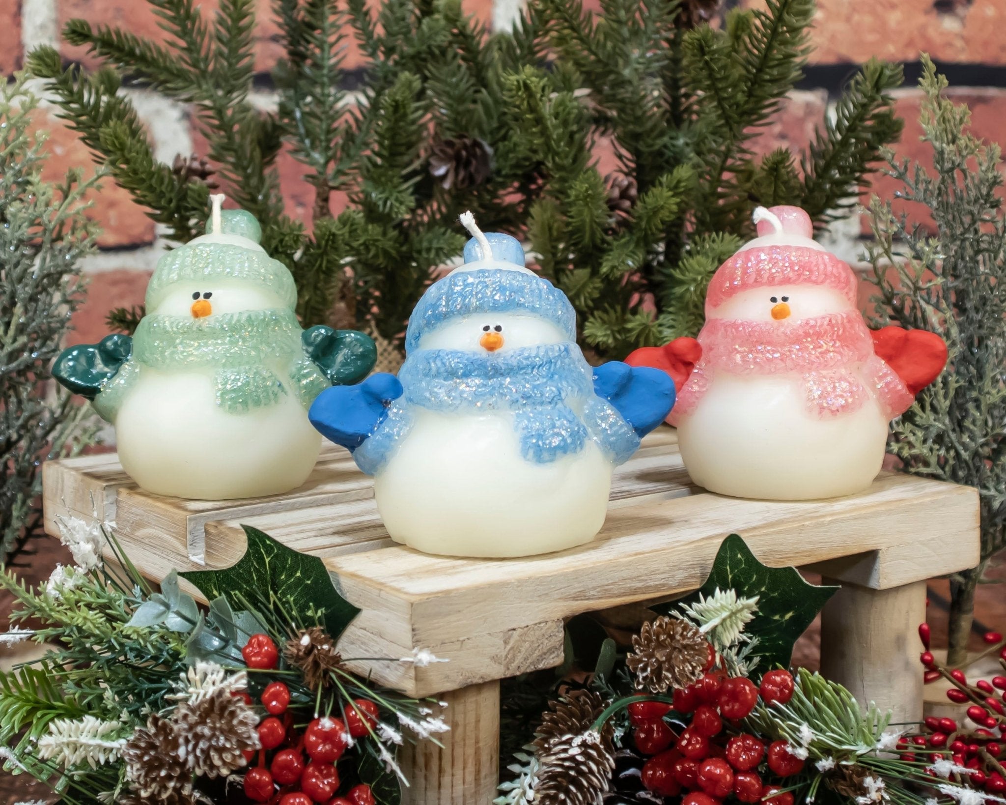 “Hand-painted glitter snowmen beeswax candles with red, blue, and green hats, made in the USA for holiday décor