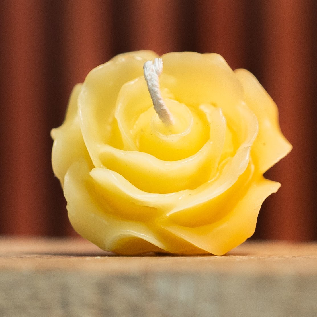 Close-up of mini rose beeswax candle from rose bud mold