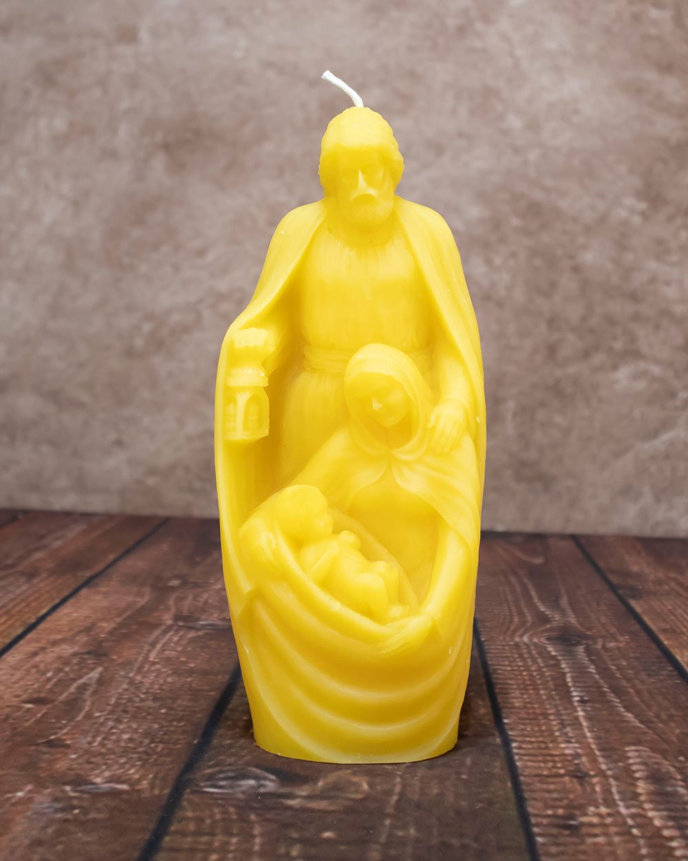 Holy Family beeswax candle showing Joseph, Mary, and Baby Jesus handcrafted from pure American beeswax.
