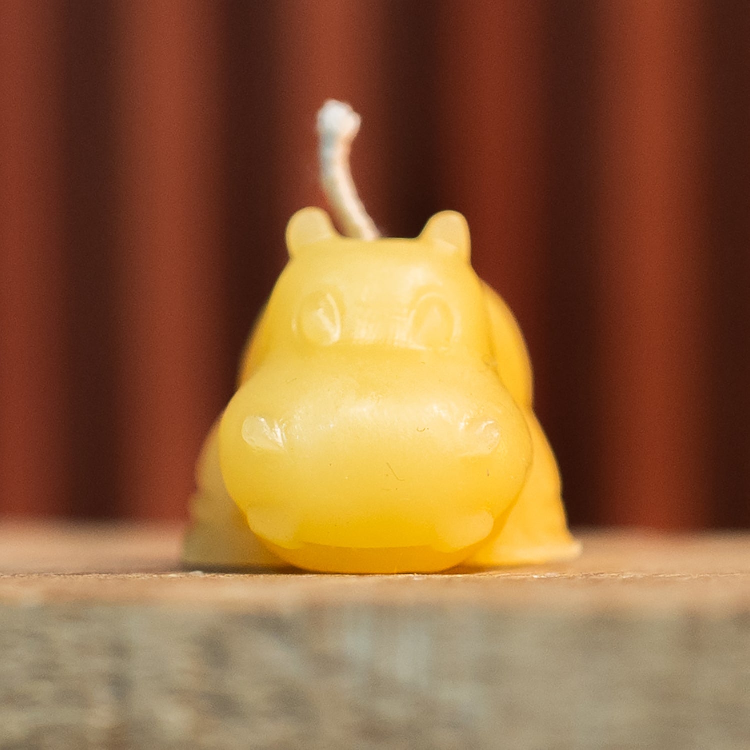 Front view of Mini Hippo Candle Mold creating cute beeswax hippo candle with smooth detail