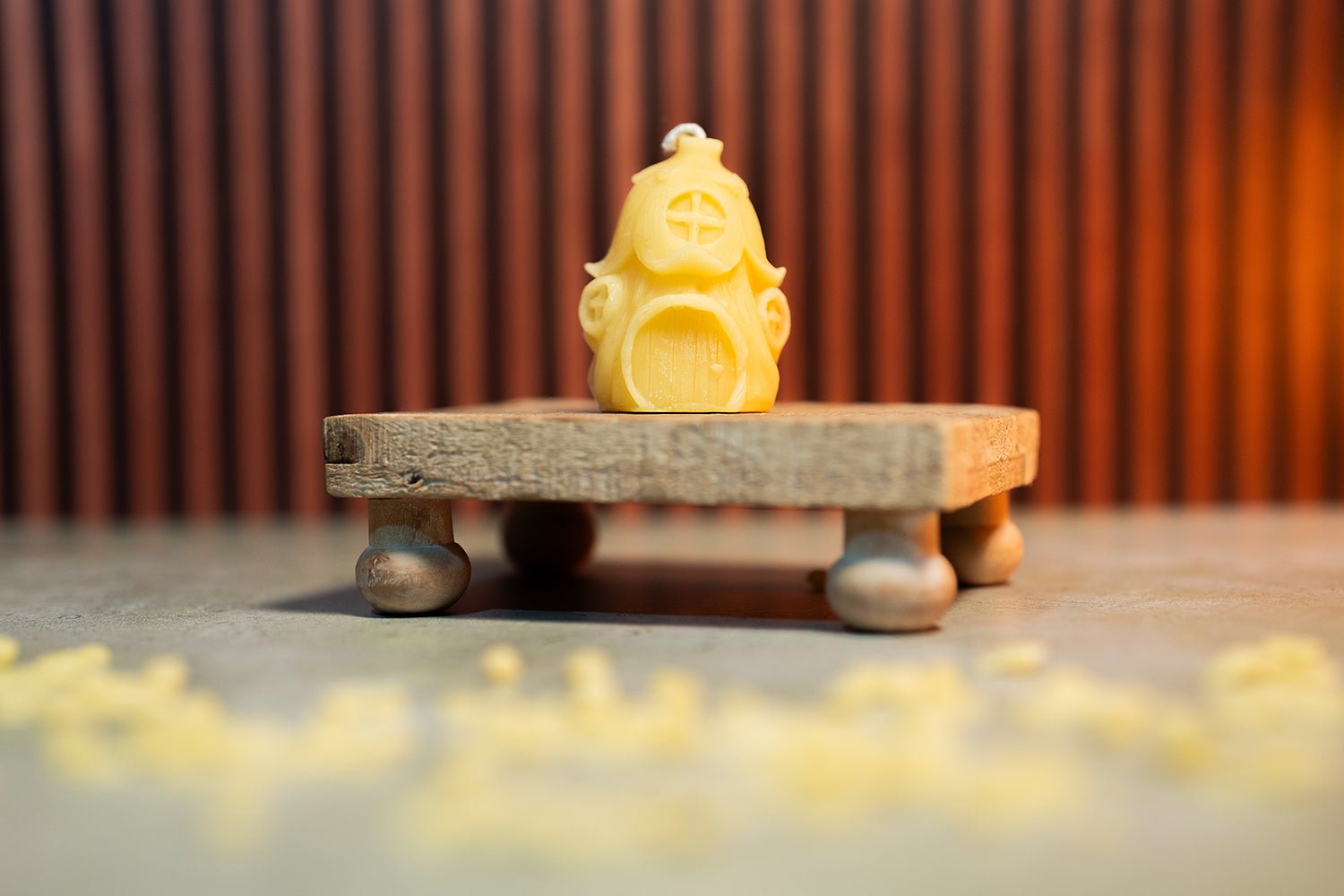 Close-up of Fairy Home beeswax candle showing roof and window details