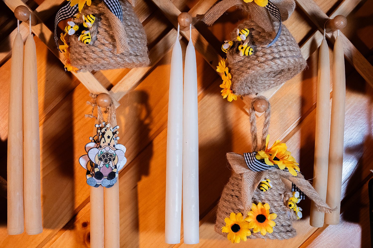 Natural beeswax taper candles displayed with sunflowers not included